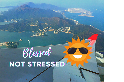 Island view from airplane, blessed not stressed title with smiling sun wearing sunglasses picture