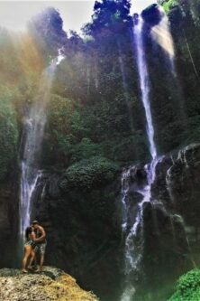 Kissing couple in front of Sekumpul waterfall Bali, Indonesia